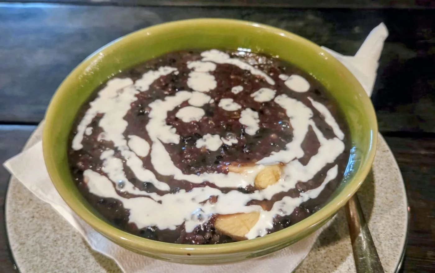 Bubur Injin Balinese black rice pudding with sliced banana and creamy coconut milk