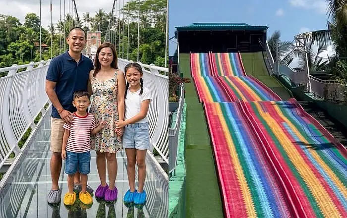 Family walking across glass bridge above the jungle canopy in Bali