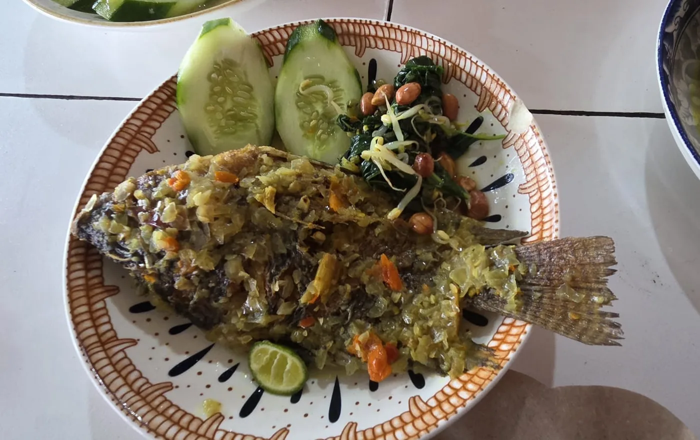 Ikan Goreng Balinese fried fish with spicy peanut sauce, spinach, and rice