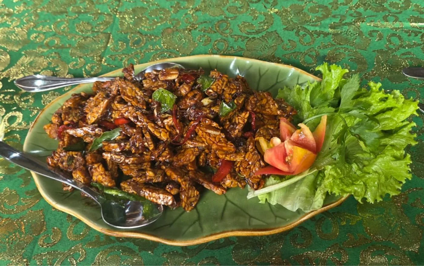Tempe Goreng crispy fried tempeh glazed with sweet teriyaki sauce on a plate