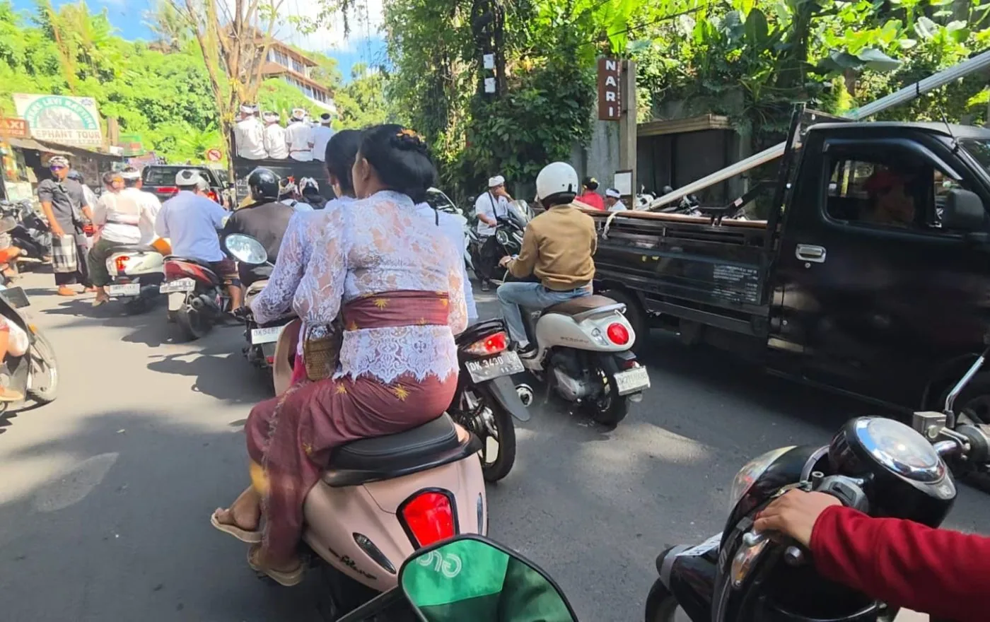 Busy Bali road with motorbikes and scooters in traffic showing road safety conditions